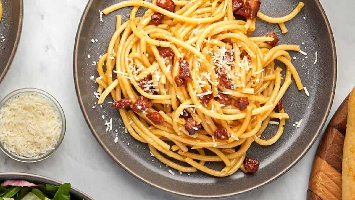 Bucatini carbonara on a plate.