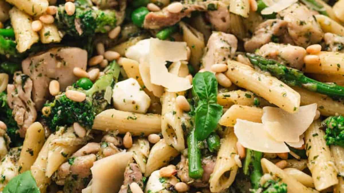 A serving of veggie pesto pasta chicken.