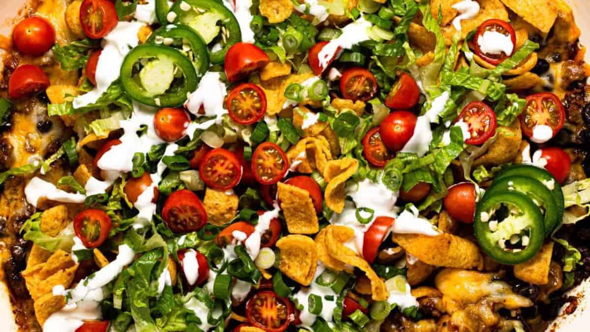 Walking taco casserole on a baking dish.