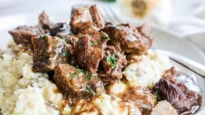 Crockpot steak bites with mashed potatoes.