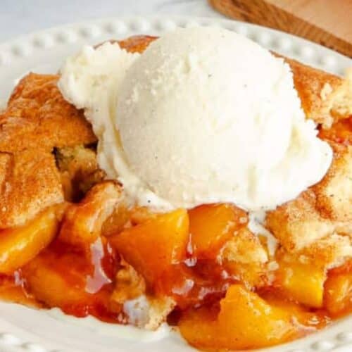 Peach cobbler with ice cream.