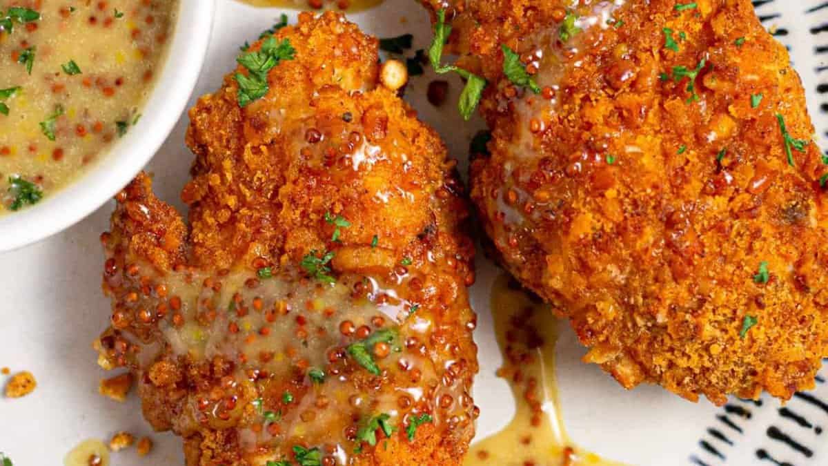 Oven fried chicken tenders with sauce.