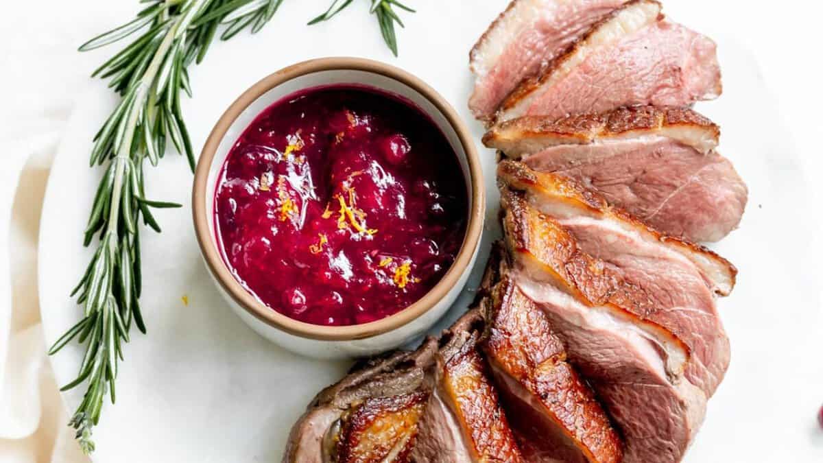 Seared Duck Breast with Cranberry Rosemary Sauce.