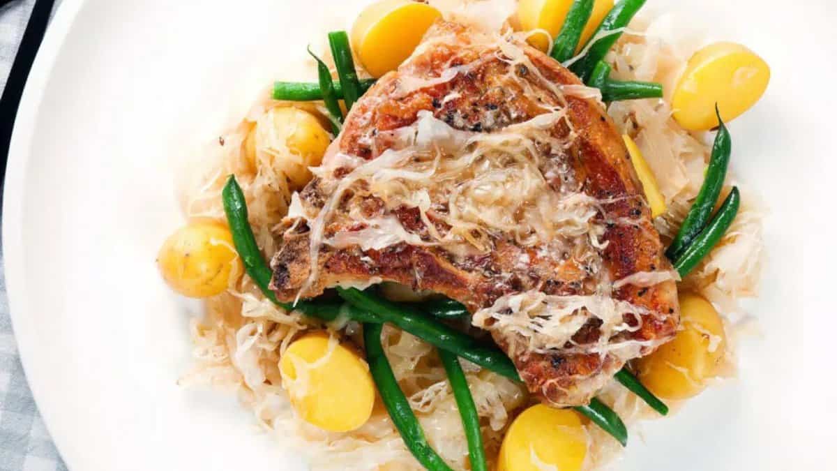 Slow Cooker Pork Chops with Potatoes and Sauerkraut.