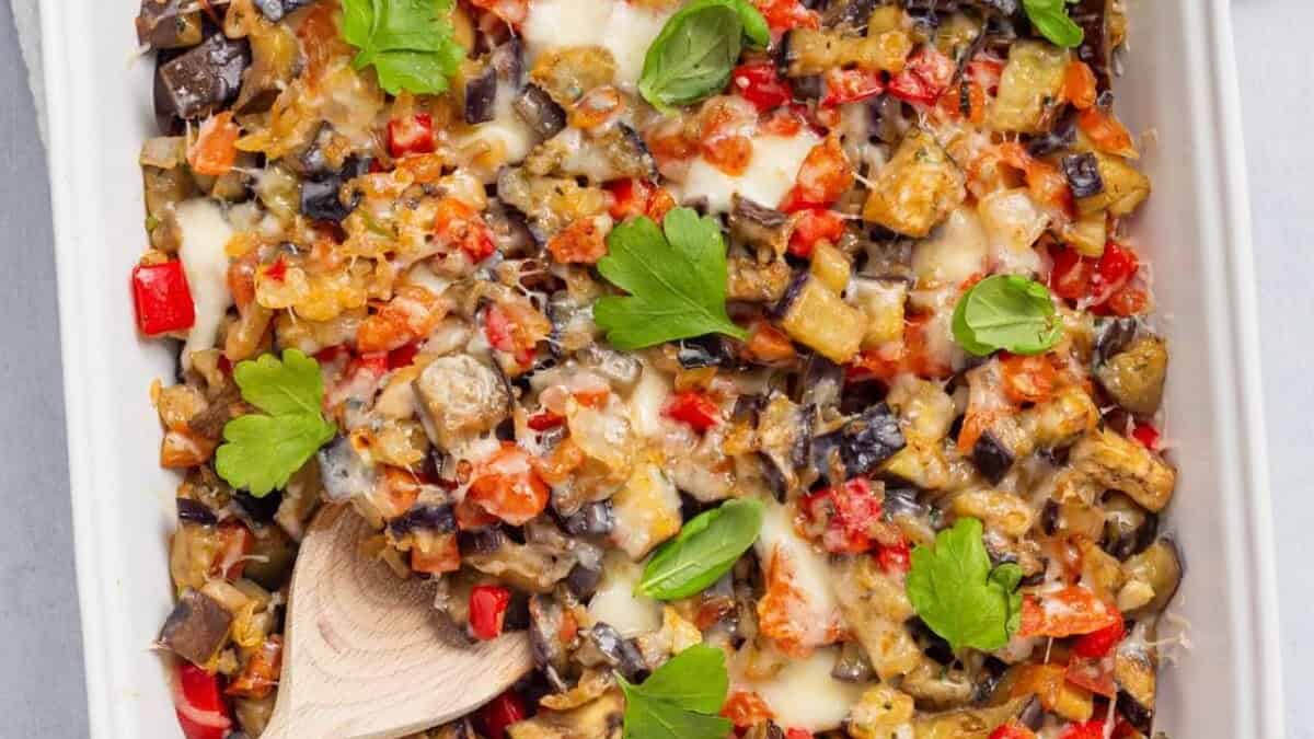 Eggplant casserole in a white dish.