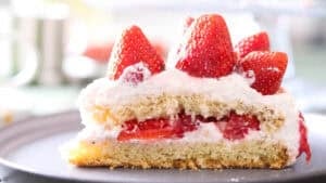A slice of strawberry cream cake.