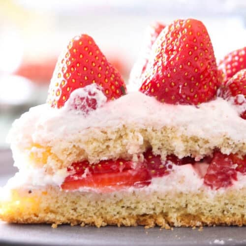 A slice of strawberry cream cake.