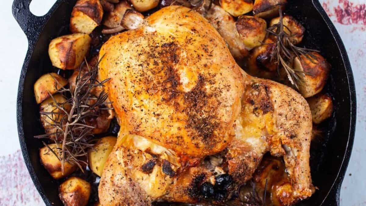 Juicy Cast-Iron Brie Stuffed Roast Chicken.