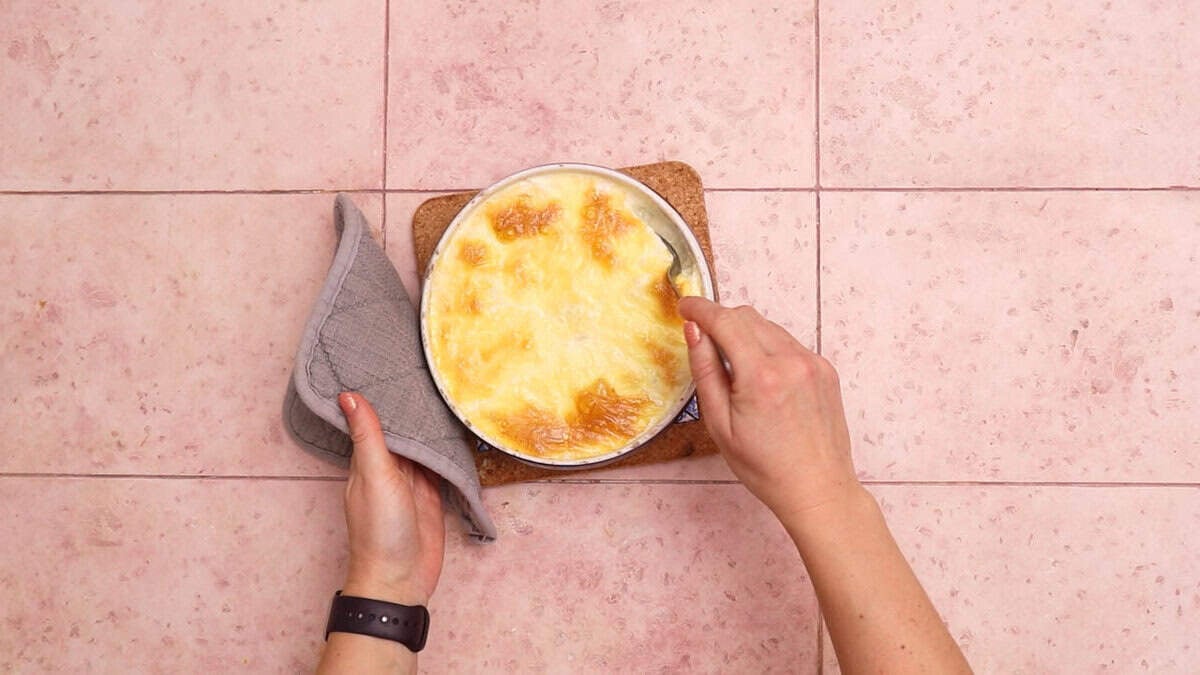 Mixing brie mac and cheese after almost finished cooking.