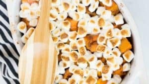 Sweet potato casserole topped with marshmallows.