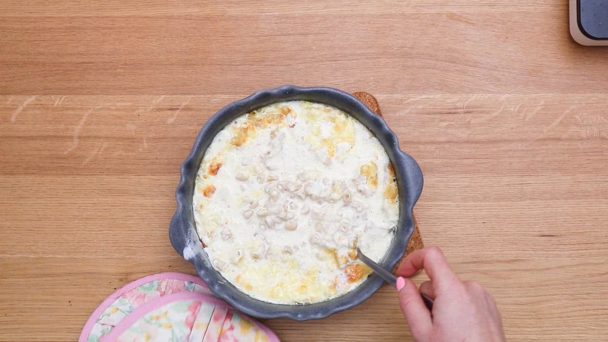 Truffle mac and cheese after mixing halfway.