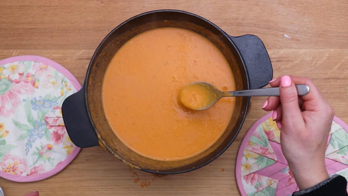 Taste testing coconut lentil soup.