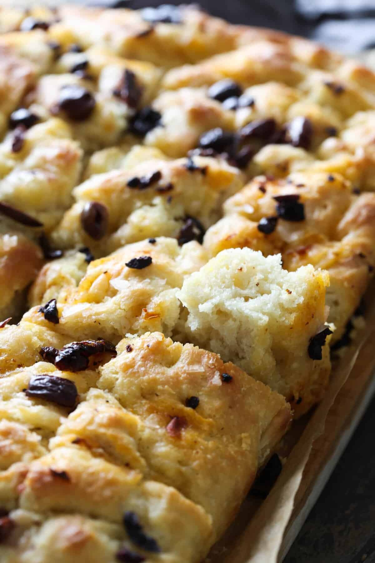Easy overnight focaccia topped with black olives.