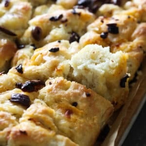 Easy overnight focaccia topped with black olives.