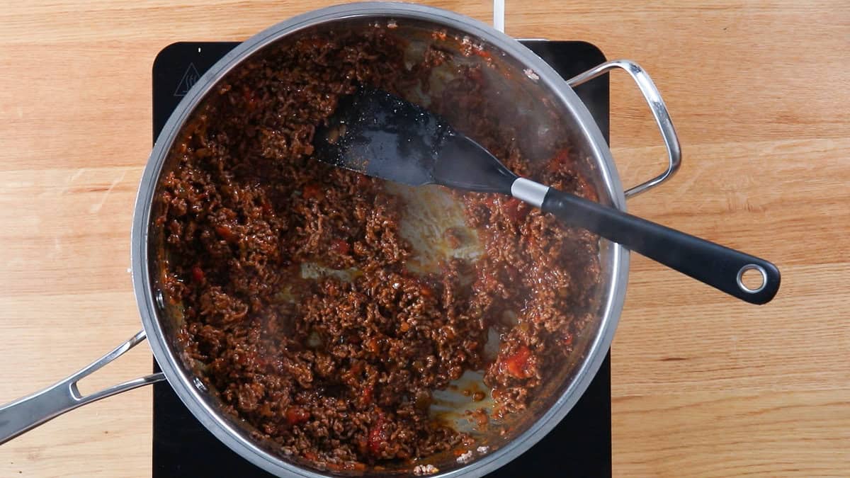 Ground beef seasoned with taco flavors in a skillet.