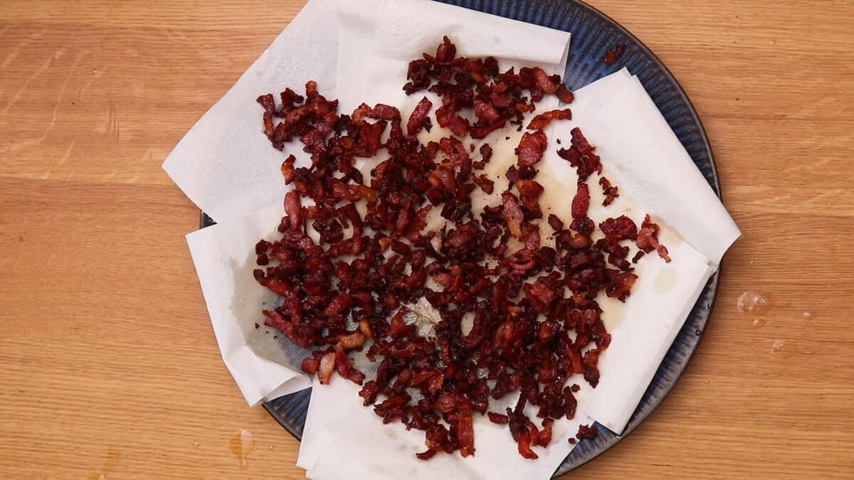 Crispy fried bacon on a paper towel.