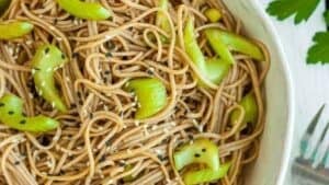 A bowl full of soba noodle salad.