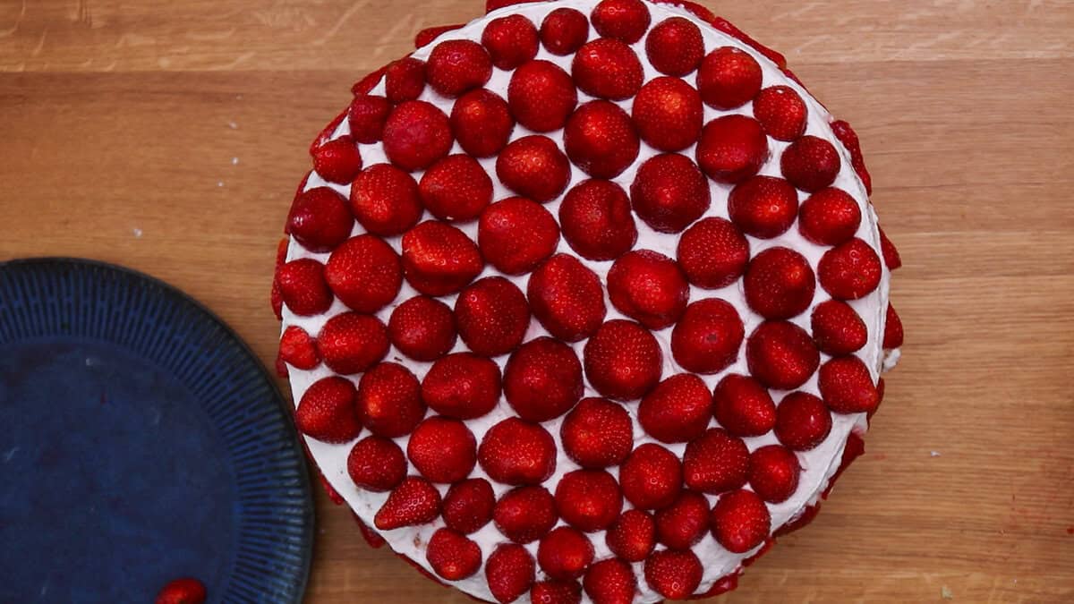 A finished strawberry cream cake.
