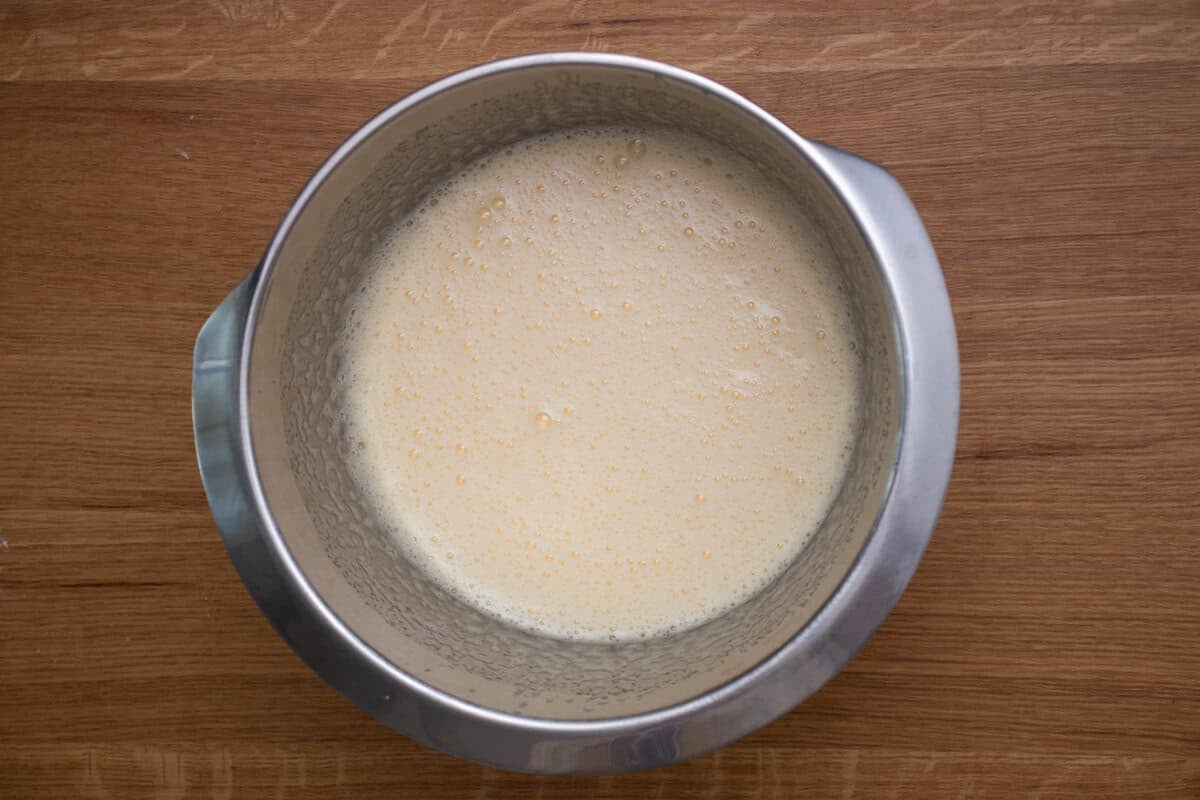 Eggs and sugar in a mixing bowl after mixing to just the right degree.