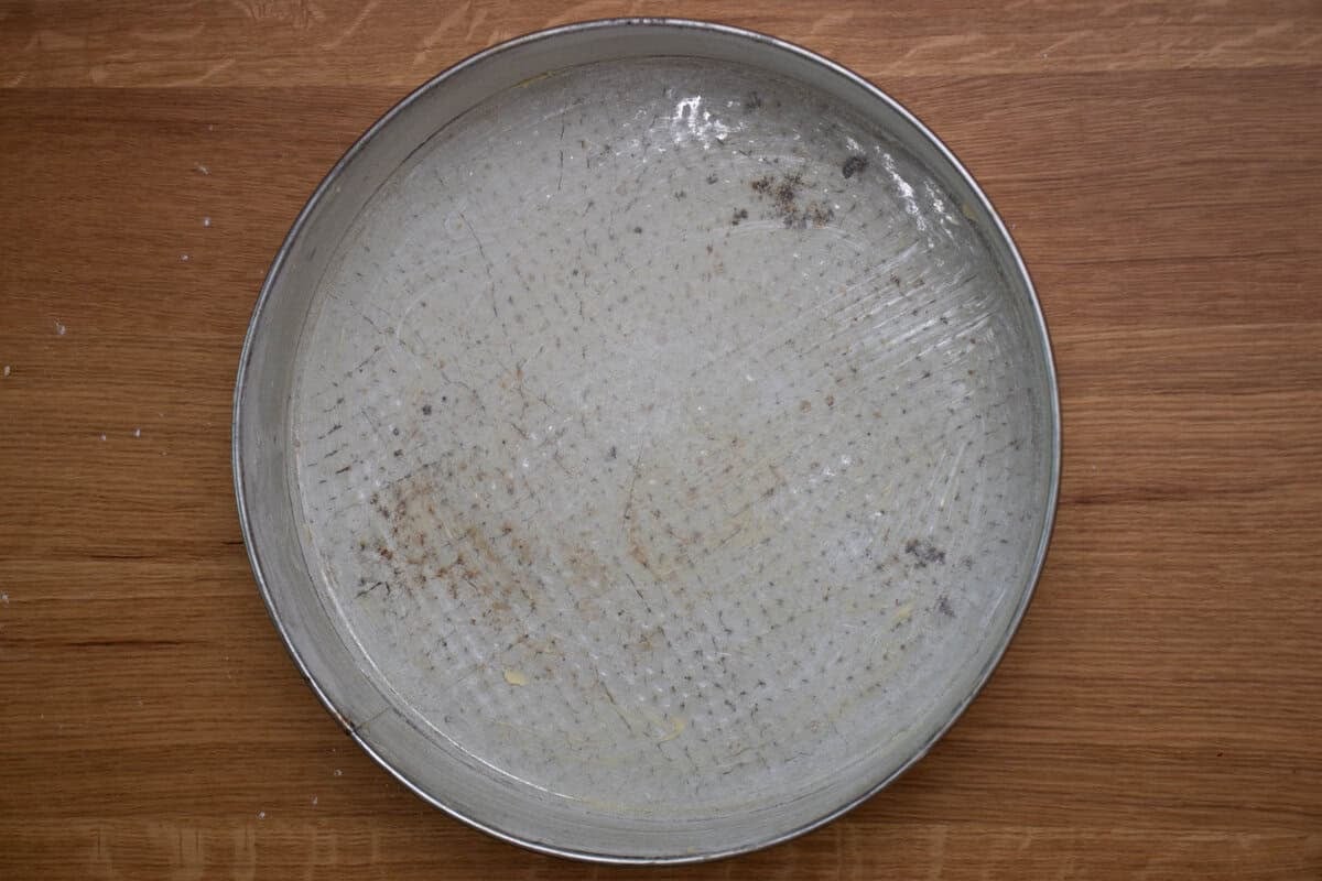 A springform greased with butter and covered with flour.
