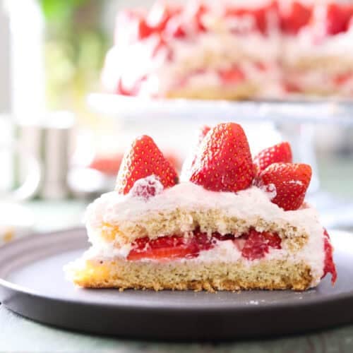 A slice of strawberry cream cake.