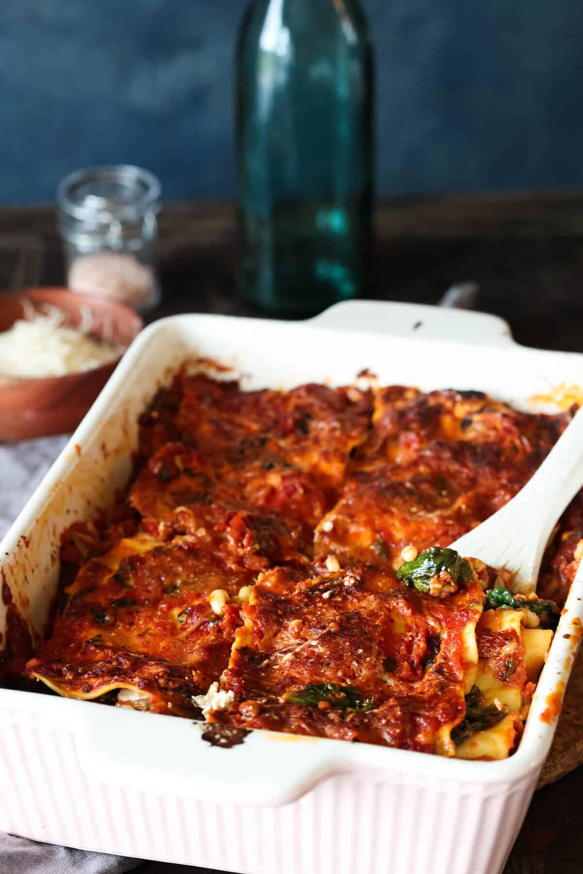 Spinach lasagna with tomato sauce, sun-dried tomatoes and pine nuts.
