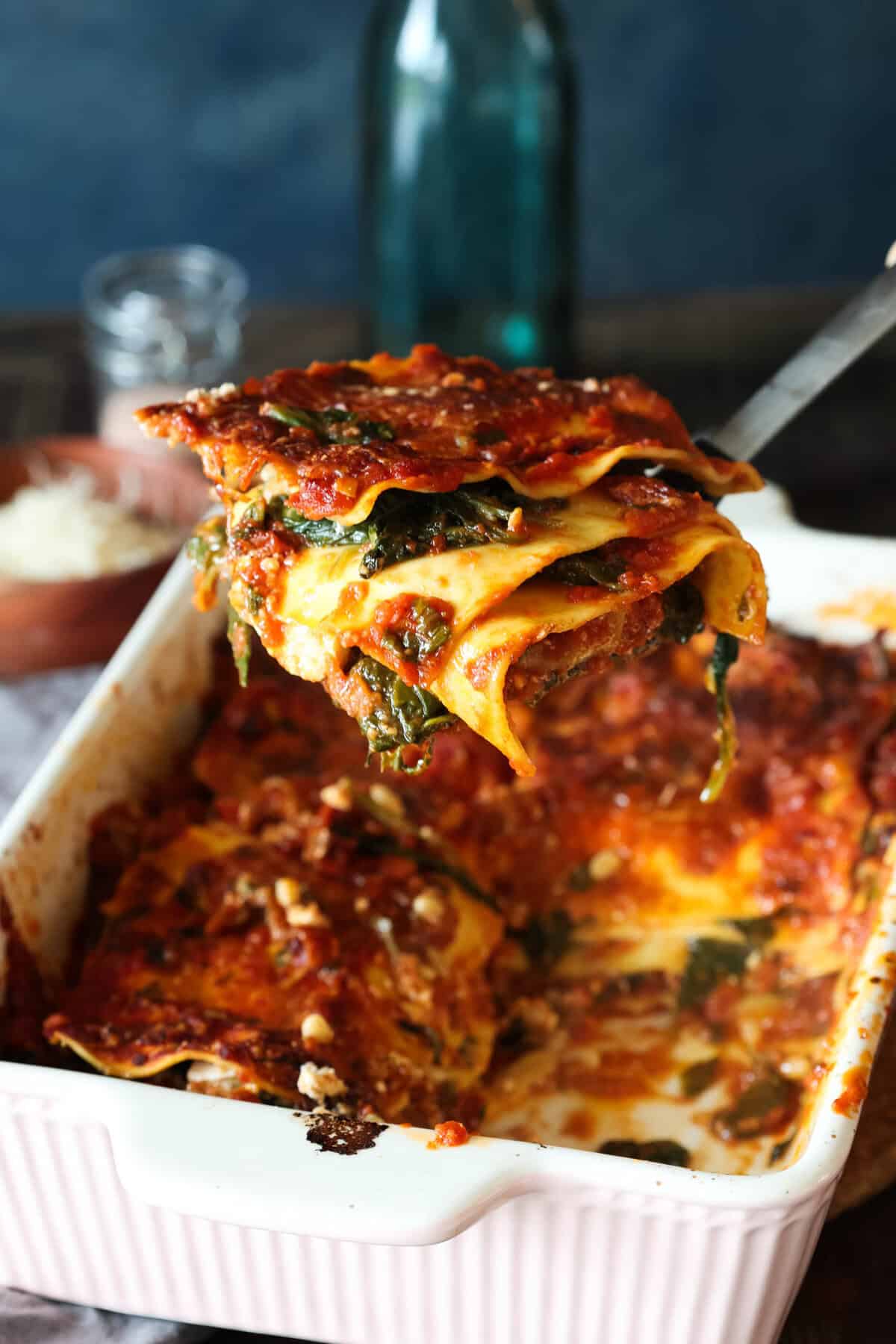 Spinach lasagna with tomato sauce, sun-dried tomatoes and pine nuts.